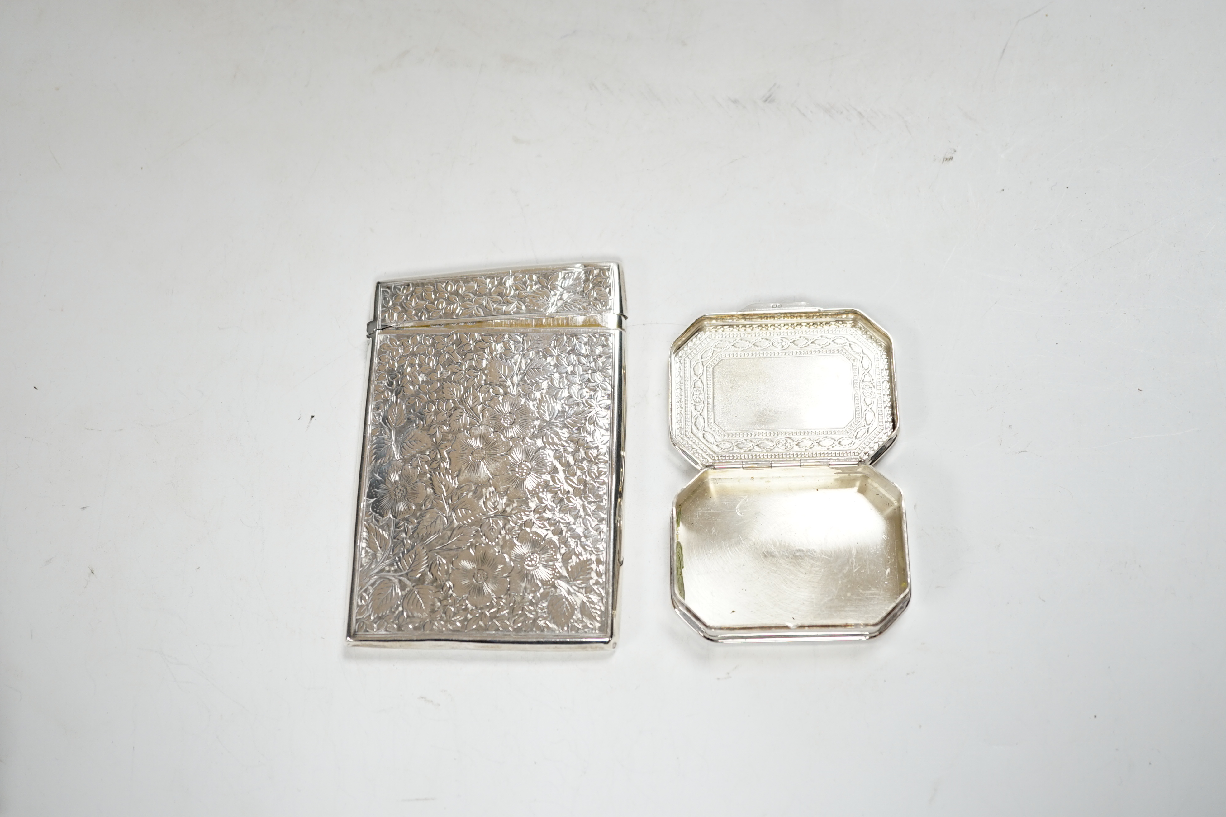 A late Victorian engraved silver rectangular card case, George Unite, Birmingham, 1895, 99mm, together with a modern silver pill box.